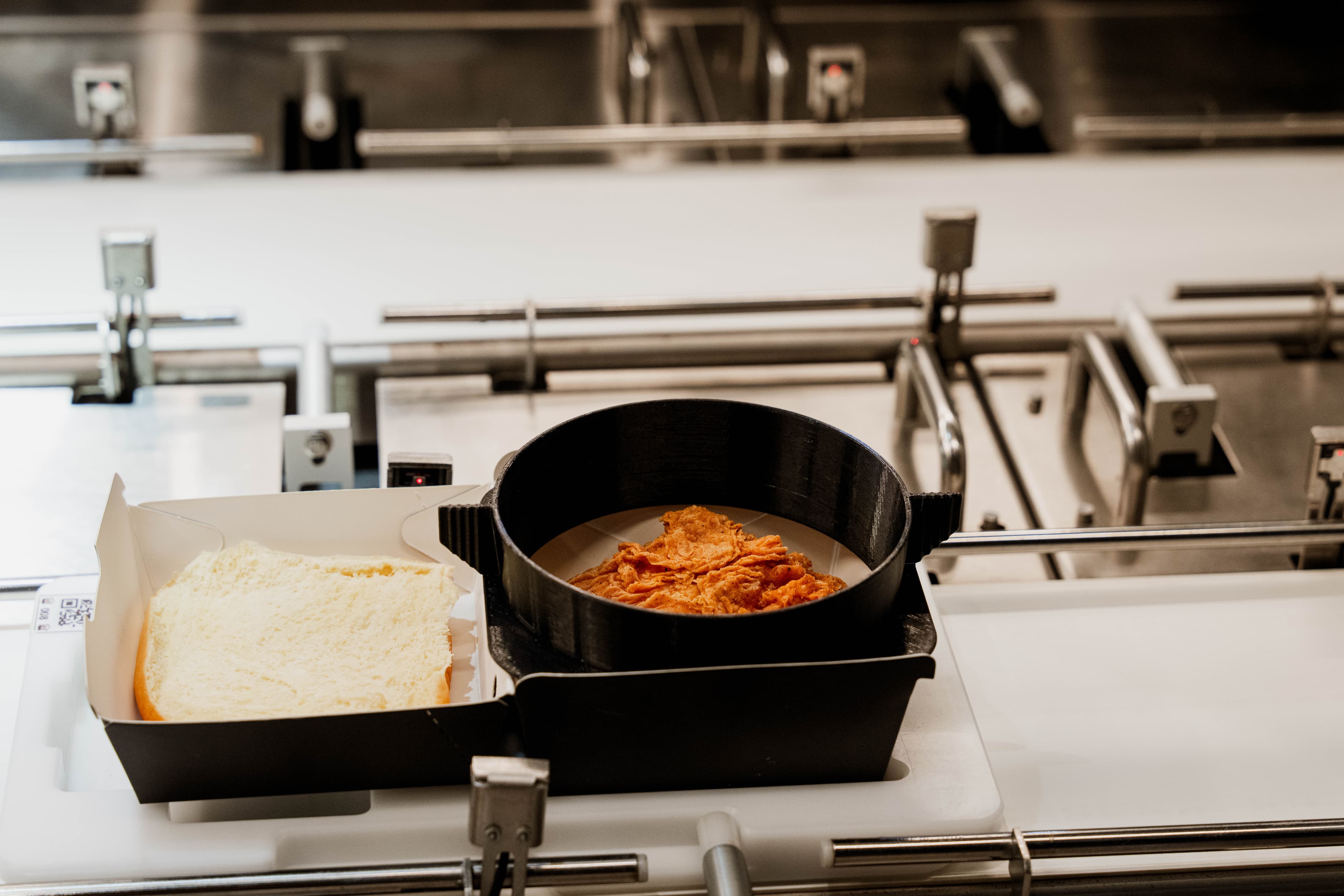 Fried chicken moving along the production belt